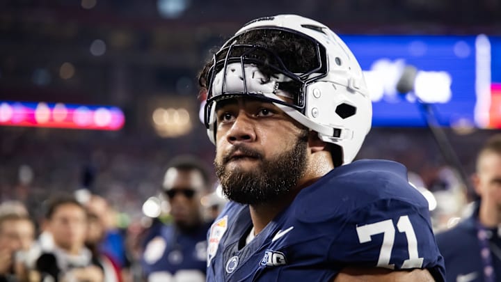 Dec 31, 2024; Glendale, AZ, USA; Penn State Nittany Lions offensive lineman Olaivavega Ioane (71) against the Boise State Broncos during the Fiesta Bowl at State Farm Stadium. Mandatory Credit: Mark J. Rebilas-Imagn Images