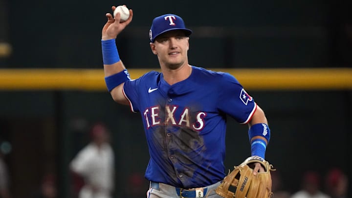 Sep 11, 2024; Phoenix, Arizona, USA; Texas Rangers third base Josh Jung (6) makes the play for an out against the Arizona Diamondbacks in the first inning at Chase Field. Mandatory Credit: Rick Scuteri-Imagn Images Sep 11, 2024; Phoenix, Arizona, USA; Texas Rangers third base Josh Jung (6) makes the play for an out against the Arizona Diamondbacks in the first inning at Chase Field. Mandatory Credit: Rick Scuteri-Imagn Images