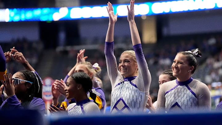 LSU gymnast Livvy Dunne celebrates with teammates during Session 2 of the SEC Gymnastics Championship at Legacy Arena in Birmingham, Alabama. 