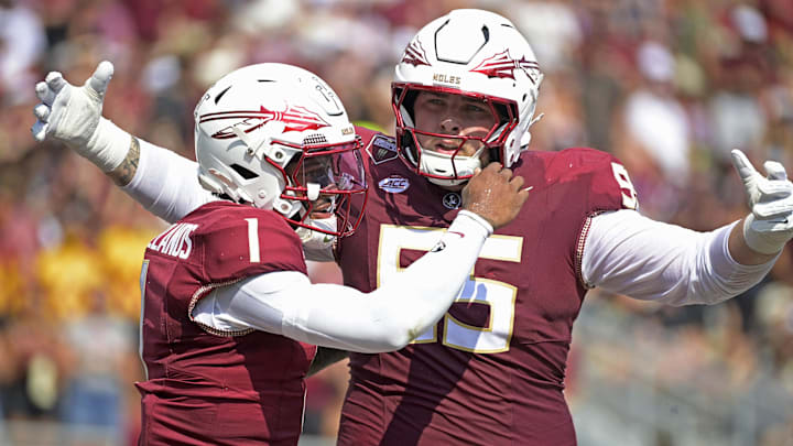 Sep 20, 2025; Tallahassee, Florida, USA; Florida State Seminoles quarterback Thomas Castellanos (1) celebrates with offensive lineman Gunnar Hansen (55) during the first half against the Kent State Golden Flashes at Doak S. Campbell Stadium. Mandatory Credit: Melina Myers-Imagn Images
