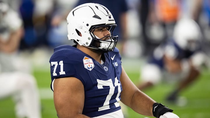 Dec 31, 2024; Glendale, AZ, USA; Penn State Nittany Lions offensive lineman Olaivavega Ioane (71) against the Boise State Broncos during the Fiesta Bowl at State Farm Stadium. Mandatory Credit: Mark J. Rebilas-Imagn Images