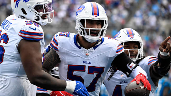 Buffalo Bills defensive end A.J. Epenesa (57) celebrates with guard Connor McGovern (66) and linebacker Dorian Williams (42)  after intercepting a pass in the second quarter against the Carolina Panthers at Bank of America Stadium.