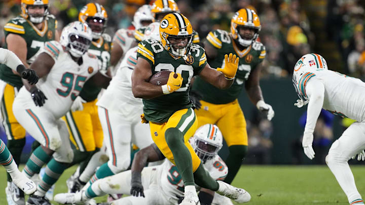 Green Bay Packers running back Chris Brooks (30) rushes with the football during the second quarter against the Miami Dolphins at Lambeau Field. Green Bay Packers running back Chris Brooks (30) rushes with the football during the second quarter against the Miami Dolphins at Lambeau Field.