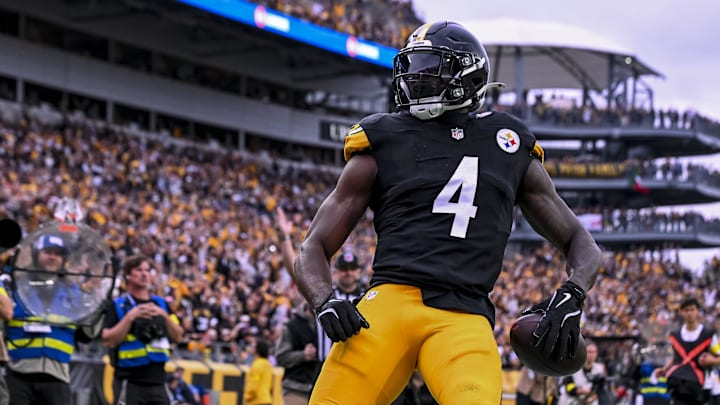 Oct 12, 2025; Pittsburgh, Pennsylvania, USA; Pittsburgh Steelers wide receiver DK Metcalf (4) makes a catch for a touchdown during the fourth quarter at Acrisure Stadium. Mandatory Credit: Barry Reeger-Imagn Images