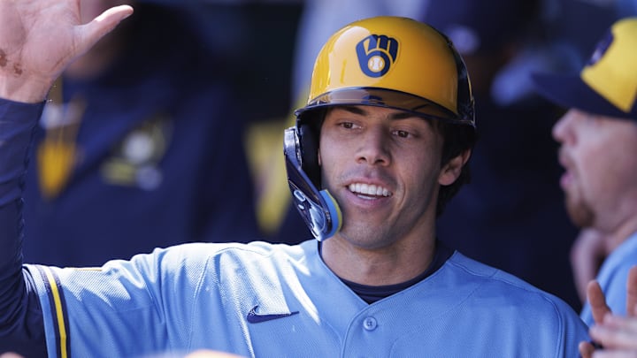 Apr 4, 2026; Kansas City, Missouri, USA; Milwaukee Brewers left fielder Christian Yelich (22) celebrates in the dugout after scoring during the first inning against the Kansas City Royals at Kauffman Stadium. Mandatory Credit: William Purnell-Imagn Images