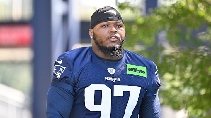 Jul 23, 2025; Foxborough, MA, USA; New England Patriots defensive end Milton Williams (97) walks to the practice field for training camp at Gillette Stadium. Mandatory Credit: Eric Canha-Imagn Images