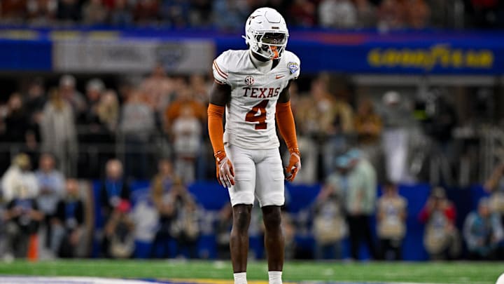 Jan 10, 2025; Arlington, TX, USA; Texas Longhorns defensive back Andrew Mukuba (4) in action during the game between the Texas Longhorns and the Ohio State Buckeyes at AT&T Stadium. Jan 10, 2025; Arlington, TX, USA; Texas Longhorns defensive back Andrew Mukuba (4) in action during the game between the Texas Longhorns and the Ohio State Buckeyes at AT&T Stadium.