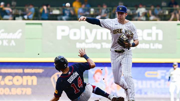 Aug 22, 2026; Milwaukee, Wisconsin, USA; Milwaukee Brewers shortstop Cooper Pratt (12) completes a double play after forcing out Atlanta Braves second baseman Mauricio Dubon (14) in the fourth inning at American Family Field. Mandatory Credit: Benny Sieu-Imagn Images Aug 22, 2026; Milwaukee, Wisconsin, USA; Milwaukee Brewers shortstop Cooper Pratt (12) completes a double play after forcing out Atlanta Braves second baseman Mauricio Dubon (14) in the fourth inning at American Family Field. Mandatory Credit: Benny Sieu-Imagn Images