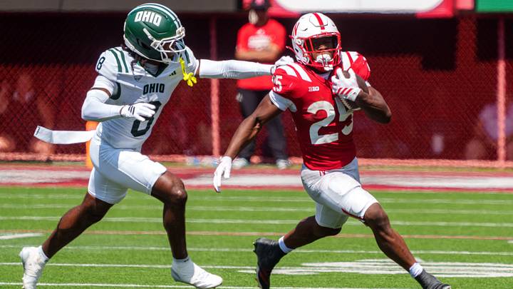 Jamal Rule runs against Ohio Bobcats defensive back Barry Dillon. Jamal Rule runs against Ohio Bobcats defensive back Barry Dillon.
