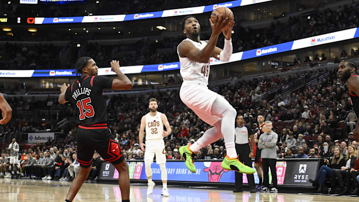 Nov 11, 2024; Chicago, Illinois, USA;  Cleveland Cavaliers guard Donovan Mitchell (45) attempts a shot against the Chicago Bulls during the first half at United Center. Mandatory Credit: Matt Marton-Imagn Images