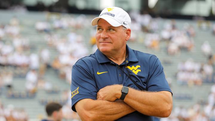 Sep 5, 2026; Morgantown, West Virginia, USA; West Virginia Mountaineers head coach Rich Rodriguez watches during warmups before their game against the Coastal Carolina Chanticleers at Milan Puskar Stadium. Mandatory Credit: Ben Queen-Imagn Images Sep 5, 2026; Morgantown, West Virginia, USA; West Virginia Mountaineers head coach Rich Rodriguez watches during warmups before their game against the Coastal Carolina Chanticleers at Milan Puskar Stadium. Mandatory Credit: Ben Queen-Imagn Images
