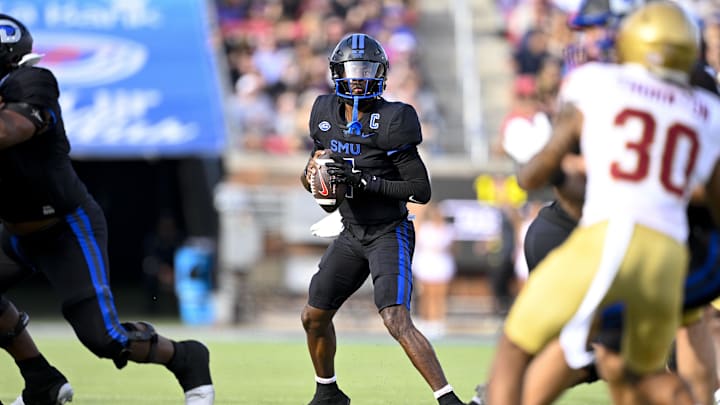 SMU Mustangs quarterback Kevin Jennings (7) drops back to pass against the Boston College Eagles during the first half at the Gerald J. Ford Stadium. SMU Mustangs quarterback Kevin Jennings (7) drops back to pass against the Boston College Eagles during the first half at the Gerald J. Ford Stadium.