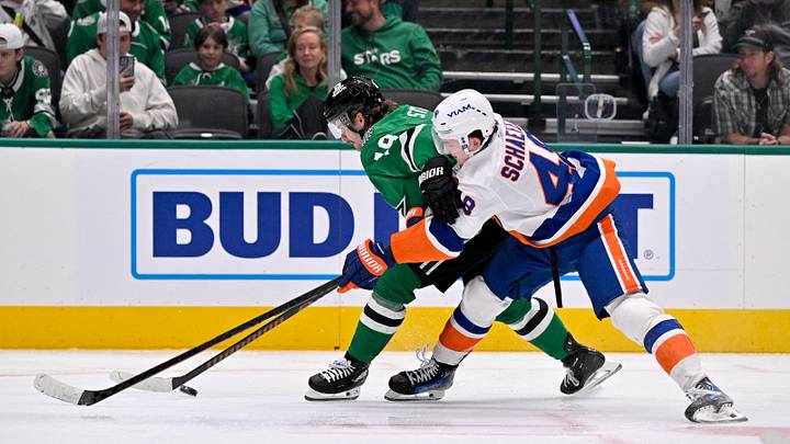 Nov 18, 2025; Dallas, Texas, USA; Dallas Stars center Sam Steel (18) skates with the puck past New York Islanders defenseman Matthew Schaefer (48) during the second period at the American Airlines Center. Mandatory Credit: Jerome Miron-Imagn Images