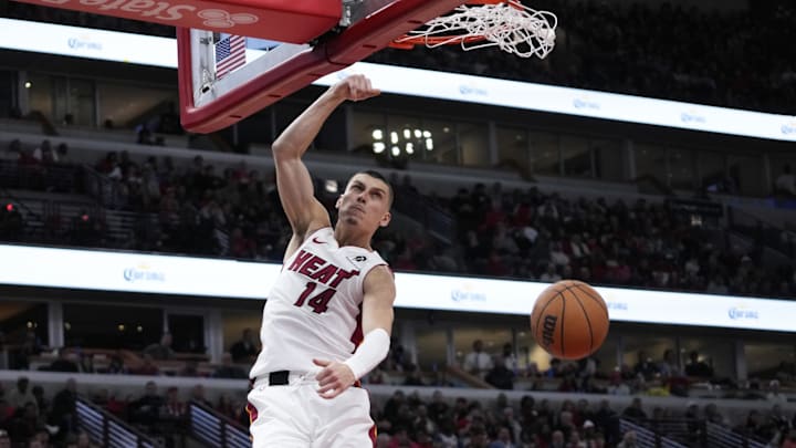 Apr 16, 2025; Chicago, Illinois, USA; Miami Heat guard Tyler Herro (14) dunks the ball against the Chicago Bulls during the second half at United Center. Mandatory Credit: David Banks-Imagn Images