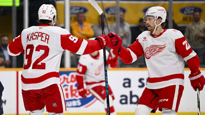 Mar 2, 2026; Nashville, Tennessee, USA;  Detroit Red Wings center Marco Kasper (92) and center Mason Appleton (22) celebrate the goal of center Emmitt Finnie (58) against the Nashville Predators during the first period at Bridgestone Arena. Mandatory Credit: Steve Roberts-Imagn Images