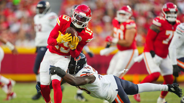 Aug 22, 2024; Kansas City, Missouri, USA; Kansas City Chiefs wide receiver Kadarius Toney (19) is tackled by Chicago Bears linebacker Amen Ogbongbemiga (45) during the first half at GEHA Field at Arrowhead Stadium. Mandatory Credit: Jay Biggerstaff-Imagn Images