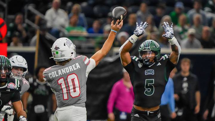 UNLV quarterback Anthony Colandrea passes over pressure from Ohio safety Adonis Williams Jr. in 2025 Frisco Bowl. UNLV quarterback Anthony Colandrea passes over pressure from Ohio safety Adonis Williams Jr. in 2025 Frisco Bowl.