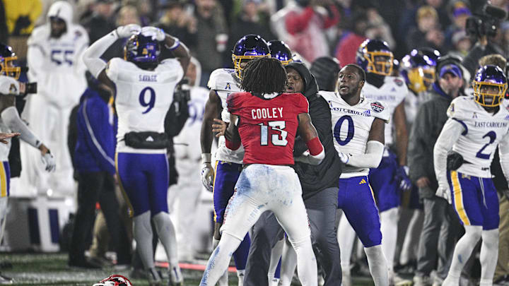Dec 28, 2024; Annapolis, MD, USA; North Carolina State Wolfpack and East Carolina Pirates players fight during the second half of the Go Bowling Military Bowl at Navy-Marine Corps Memorial Stadium. Mandatory Credit: Tommy Gilligan-Imagn Images Dec 28, 2024; Annapolis, MD, USA; North Carolina State Wolfpack and East Carolina Pirates players fight during the second half of the Go Bowling Military Bowl at Navy-Marine Corps Memorial Stadium. Mandatory Credit: Tommy Gilligan-Imagn Images