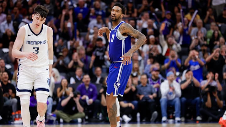 Mar 18, 2024; Sacramento, California, USA; Sacramento Kings guard Malik Monk (0) celebrates after scoring a basket during overtime against the Memphis Grizzlies at Golden 1 Center. Mandatory Credit: Sergio Estrada-USA TODAY Sports