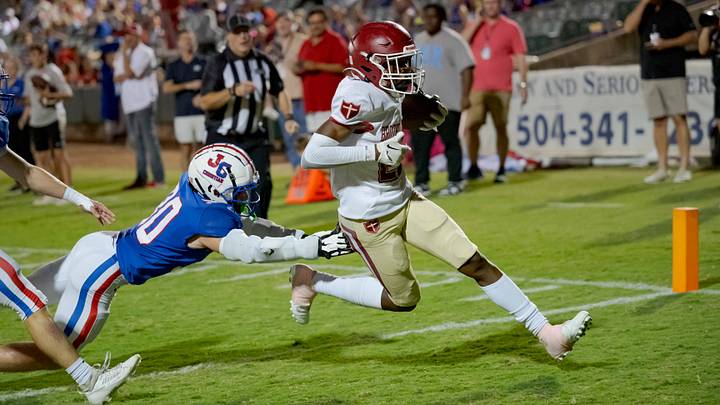 Oct 27, 2023; Metairie, LA, USA; Brother Martin Crusaders wide receiver Easton Royal (23) scores a touchdown against John Curtis Patriots linebacker Benjamin Barron (30) during the first quarter at The Shrine on Airline. Mandatory Credit: Matthew Hinton-USA TODAY Sports Oct 27, 2023; Metairie, LA, USA; Brother Martin Crusaders wide receiver Easton Royal (23) scores a touchdown against John Curtis Patriots linebacker Benjamin Barron (30) during the first quarter at The Shrine on Airline. Mandatory Credit: Matthew Hinton-USA TODAY Sports