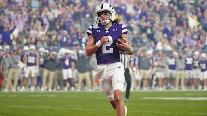 Kansas State quarterback Avery Johnson (2) scores a touchdown against Rutgers during first half of the Rate Bowl at Chase Field on Dec. 26, 2024, in Phoenix. Kansas State quarterback Avery Johnson (2) scores a touchdown against Rutgers during first half of the Rate Bowl at Chase Field on Dec. 26, 2024, in Phoenix.