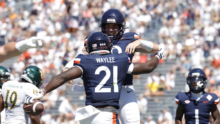 Sep 13, 2025; Charlottesville, Virginia, USA; Virginia Cavaliers running back Harrison Waylee (21) celebrates with Cavaliers defensive back Ja'Son Prevard (10) after scoring a touchdown against the William & Mary Tribe during the second quarter at Scott Stadium. Mandatory Credit: Amber Searls-Imagn Images Sep 13, 2025; Charlottesville, Virginia, USA; Virginia Cavaliers running back Harrison Waylee (21) celebrates with Cavaliers defensive back Ja'Son Prevard (10) after scoring a touchdown against the William & Mary Tribe during the second quarter at Scott Stadium. Mandatory Credit: Amber Searls-Imagn Images
