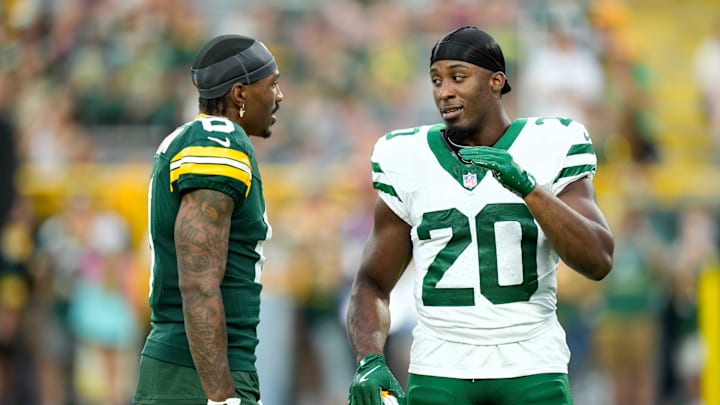 Aug 9, 2025; Green Bay, Wisconsin, USA; Green Bay Packers wide receiver Mecole Hardman (6) talks with New York Jets running back Breece Hall (20) during warmups before a preseason game at Lambeau Field. Mandatory Credit: Kayla Wolf-Imagn Images Aug 9, 2025; Green Bay, Wisconsin, USA; Green Bay Packers wide receiver Mecole Hardman (6) talks with New York Jets running back Breece Hall (20) during warmups before a preseason game at Lambeau Field. Mandatory Credit: Kayla Wolf-Imagn Images