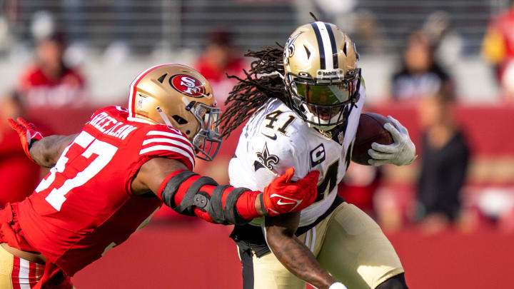 November 27, 2022; Santa Clara, California, USA; New Orleans Saints running back Alvin Kamara (41) runs the football against San Francisco 49ers linebacker Dre Greenlaw (57) during the second quarter at Levi's Stadium. Mandatory Credit: Kyle Terada-USA TODAY Sports