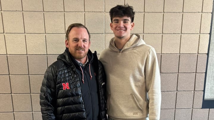 Evan Jacobson with Nebraska staff at Waukee High School