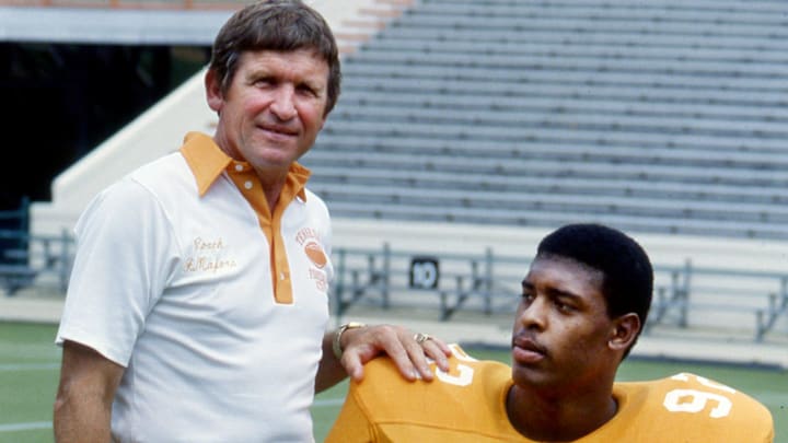 Tennessee head coach Johnny Majors, posing with Reggie White (92) during the Vols annual Picture Day Aug. 15, 1981, is pleased at having the defensive tackle back for three more seasons. Tennessee head coach Johnny Majors, posing with Reggie White (92) during the Vols annual Picture Day Aug. 15, 1981, is pleased at having the defensive tackle back for three more seasons.