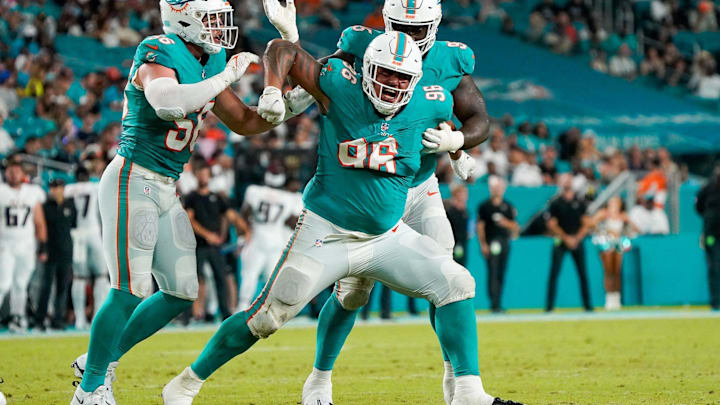 Miami Dolphins defensive tackle Brandon Pili (96) celebrates a tackle for loss during the fourth quarter of a preseason game at Hard Rock Stadium on Friday, August 11, 2023, in Miami Gardens, FL.