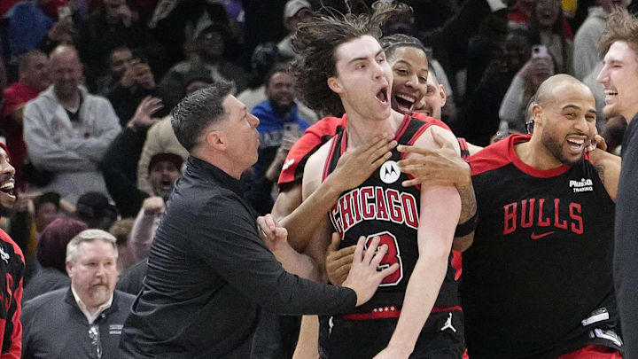 Mar 27, 2025; Chicago, Illinois, USA; Chicago Bulls guard Josh Giddey (3) celebrates with teammates after making the game-winning three point basket against the Los Angeles Lakers during the second half at United Center. Mandatory Credit: David Banks-Imagn Images