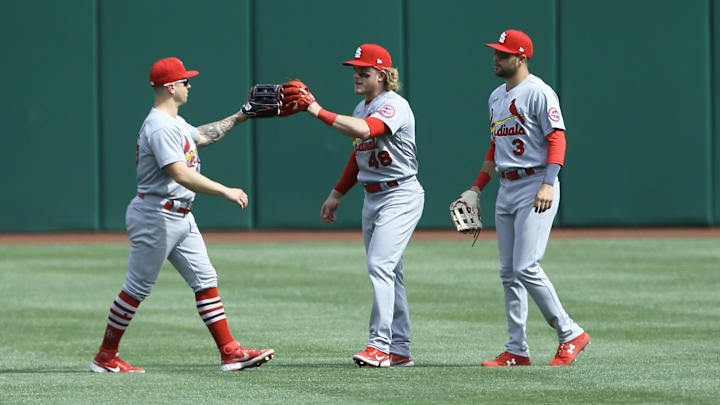 May 2, 2021; Pittsburgh, Pennsylvania, USA; St. Louis Cardinals left fielder Tyler O'Neill (left) and center fielder Harrison Bader (48) and right fielder Dylan Carlson (3) celebrate after defeating the Pittsburgh Pirates at PNC Park. St. Louis shutout Pittsburgh 3-0.  Credit: Charles LeClaire-Imagn Images