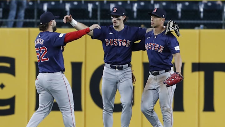 Apr 19, 2024; Pittsburgh, Pennsylvania, USA;  Boston Red Sox outfielder Wilyer Abreu (52) and centerbfielder Jarren Duran (16) and rightfielder Rob Refsnyder (right) celebrate in the outfield after defeating the Pittsburgh Pirates at PNC Park. Boston won 8-1. Mandatory Credit: Charles LeClaire-Imagn Images
