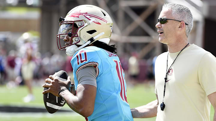 Florida State Seminoles quarterback Trever Jackson (10) and head coach Mike Norvell during the Spring Showcase at Doak S. Campbell Stadium. Florida State Seminoles quarterback Trever Jackson (10) and head coach Mike Norvell during the Spring Showcase at Doak S. Campbell Stadium.