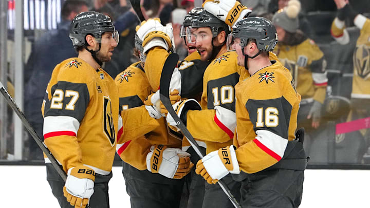 Dec 6, 2024; Las Vegas, Nevada, USA; Vegas Golden Knights center Nicolas Roy (10) celebrates with Vegas Golden Knights defenseman Shea Theodore (27) and Vegas Golden Knights left wing Pavel Dorofeyev (16) after scoring a goal against the Dallas Stars during the second period at T-Mobile Arena. Mandatory Credit: Stephen R. Sylvanie-Imagn Images