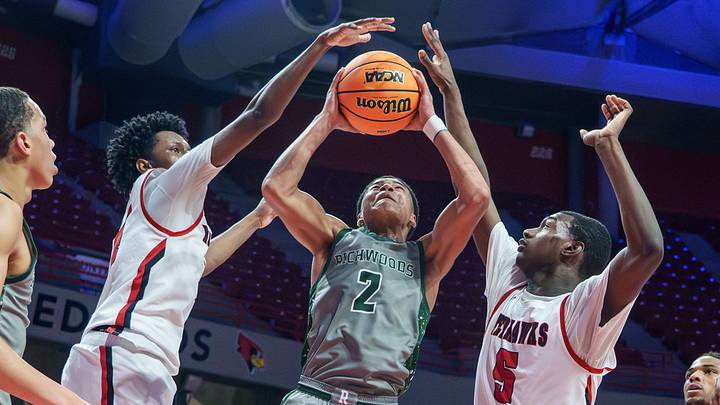 Richwoods' Amarion Smith-Holley (2) goes to the basket against Chicago Marist's Chuck Barnes Jr. , left, and Stephen Brown in the second half of the Class 4A supersectional Monday, March 9, 2026 at CEFCU Arena in Normal. The Knights fell to the RedHawks 56-53. Richwoods' Amarion Smith-Holley (2) goes to the basket against Chicago Marist's Chuck Barnes Jr. , left, and Stephen Brown in the second half of the Class 4A supersectional Monday, March 9, 2026 at CEFCU Arena in Normal. The Knights fell to the RedHawks 56-53.