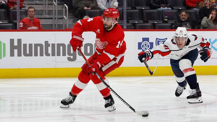 Detroit Red Wings center Dylan Larkin (71) takes a shot in the second period against the Washington Capitals at Little Caesars Arena. Mandatory Credit: Rick Osentoski-USA TODAY Sports