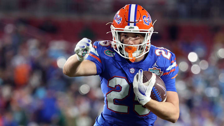 Dec 20, 2024; Tampa, FL, USA; Florida Gators running back Anthony Rubio (25) runs the ball in for a touchdown against the Tulane Green Wave during the second half at Raymond James Stadium. Mandatory Credit: Kim Klement Neitzel-Imagn Images