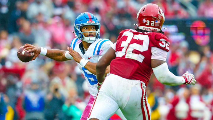 Ole Miss Rebels quarterback Trinidad Chambliss (6) throws as Oklahoma Sooners defensive lineman R Mason Thomas (32) defends. Ole Miss Rebels quarterback Trinidad Chambliss (6) throws as Oklahoma Sooners defensive lineman R Mason Thomas (32) defends.