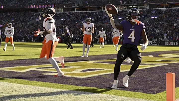 Nov 3, 2024; Baltimore, Maryland, USA;  Baltimore Ravens wide receiver Zay Flowers (4) reacts after scoring a touchdown during the first half against the Denver Broncos at M&T Bank Stadium. 