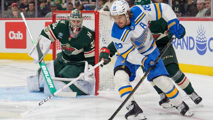 Mar 1, 2026; Saint Paul, Minnesota, USA; St. Louis Blues center Robert Thomas (18) attempts a wrap around on Minnesota Wild goaltender Filip Gustavsson (32) in the third period at Grand Casino Arena. Mandatory Credit: Matt Blewett-Imagn Images