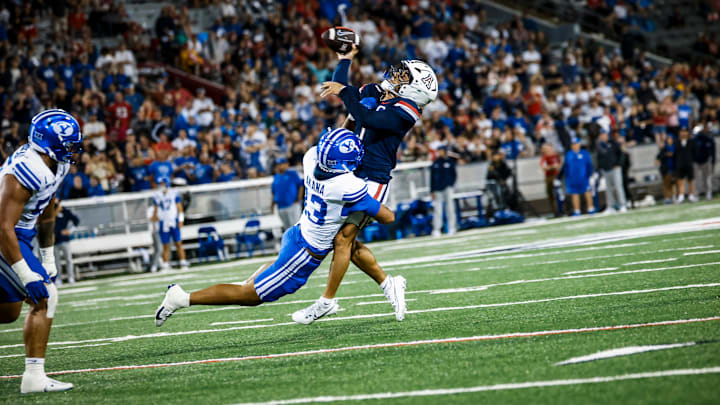BYU defensive end Tausili Akana pressures Noah Fifita in Cougars' win over Arizona