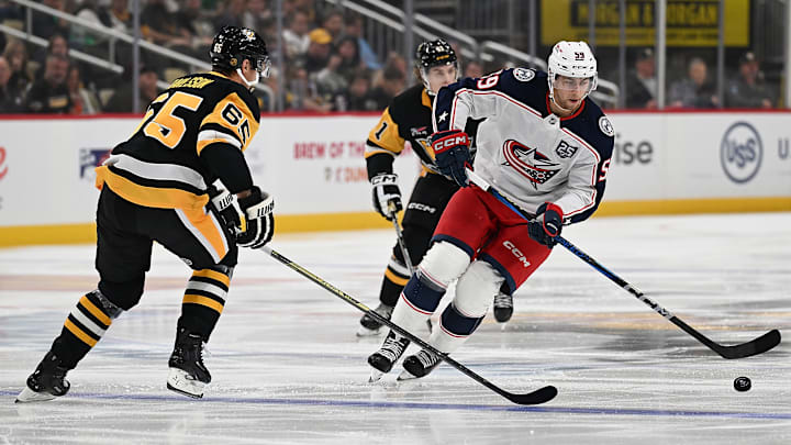 Blue Jackets winger Yegor Chinakhov skates with the puck against the Pittsburgh Penguins. 