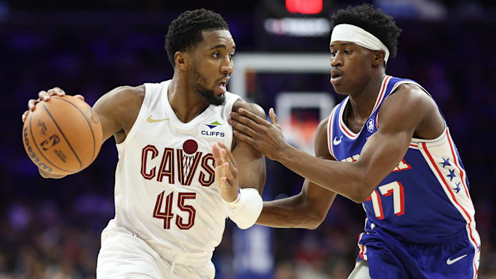 Jan 14, 2026; Philadelphia, Pennsylvania, USA; Cleveland Cavaliers guard Donovan Mitchell (45) drives against Philadelphia 76ers guard Vj Edgecombe (77) during the third quarter at Xfinity Mobile Arena. Mandatory Credit: Bill Streicher-Imagn Images