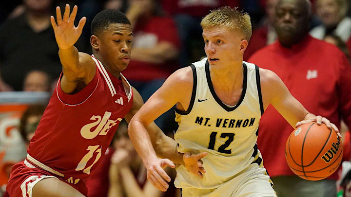 Mt. Vernon Marauders guard Luke Ertel (12) rushes up the court Mt. Vernon Marauders guard Luke Ertel (12) rushes up the court