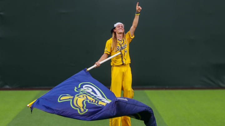 Savannah Banana Dakota Albritton waves a flag during the first game of the Banana Ball Championship series on Thursday, October 2, 2025 at Historic Grayson Stadium.
