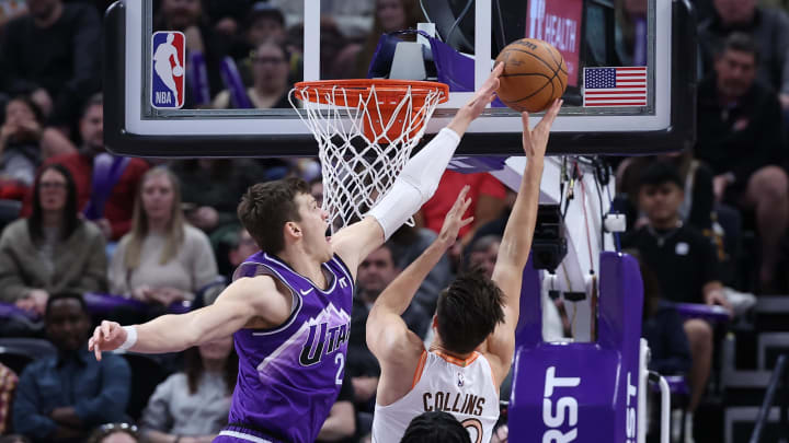 Feb 25, 2024; Salt Lake City, Utah, USA; Utah Jazz center Walker Kessler (24) blocks the shot of San Antonio Spurs forward Zach Collins (23) during the second quarter at Delta Center. Feb 25, 2024; Salt Lake City, Utah, USA; Utah Jazz center Walker Kessler (24) blocks the shot of San Antonio Spurs forward Zach Collins (23) during the second quarter at Delta Center.