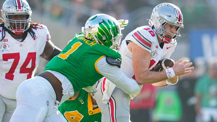 Oregon's Jordan Burch sacks Ohio State quarterback Will Howard  in the playoff quarterfinals. Burch would perfectly fit the Bears scheme on the edge.