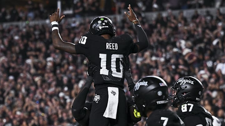 Texas A&M Aggies quarterback Marcel Reed is hoisted in celebration after scoring a touchdown in the fourth quarter against the Mississippi State Bulldogs at Kyle Field.